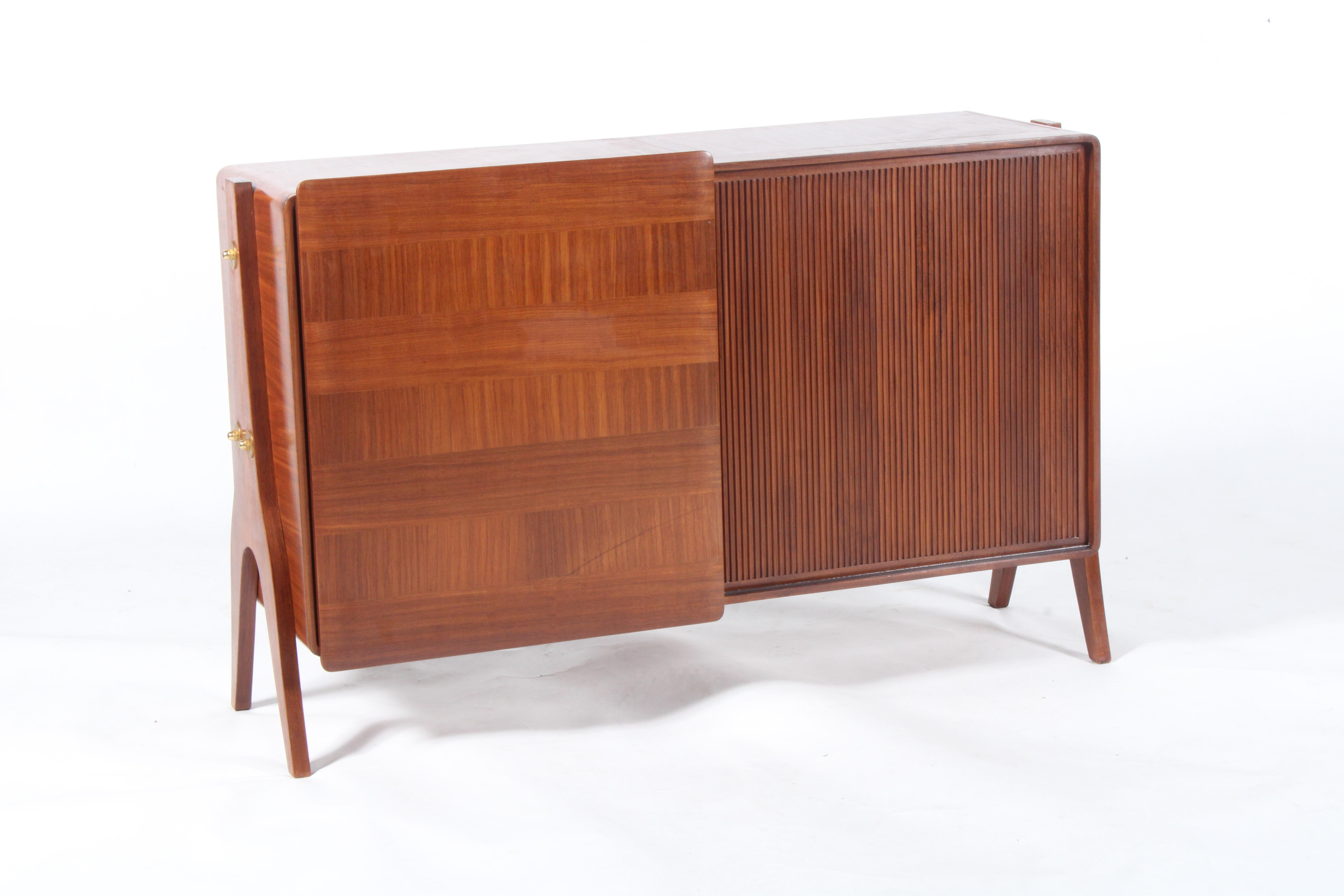 A super stylish original mid century Italian sideboard with ample storage on both sides. This delightful and unusual piece has the added benefit of being finished to both the front and rear and as such can be placed away from a wall or centrally in