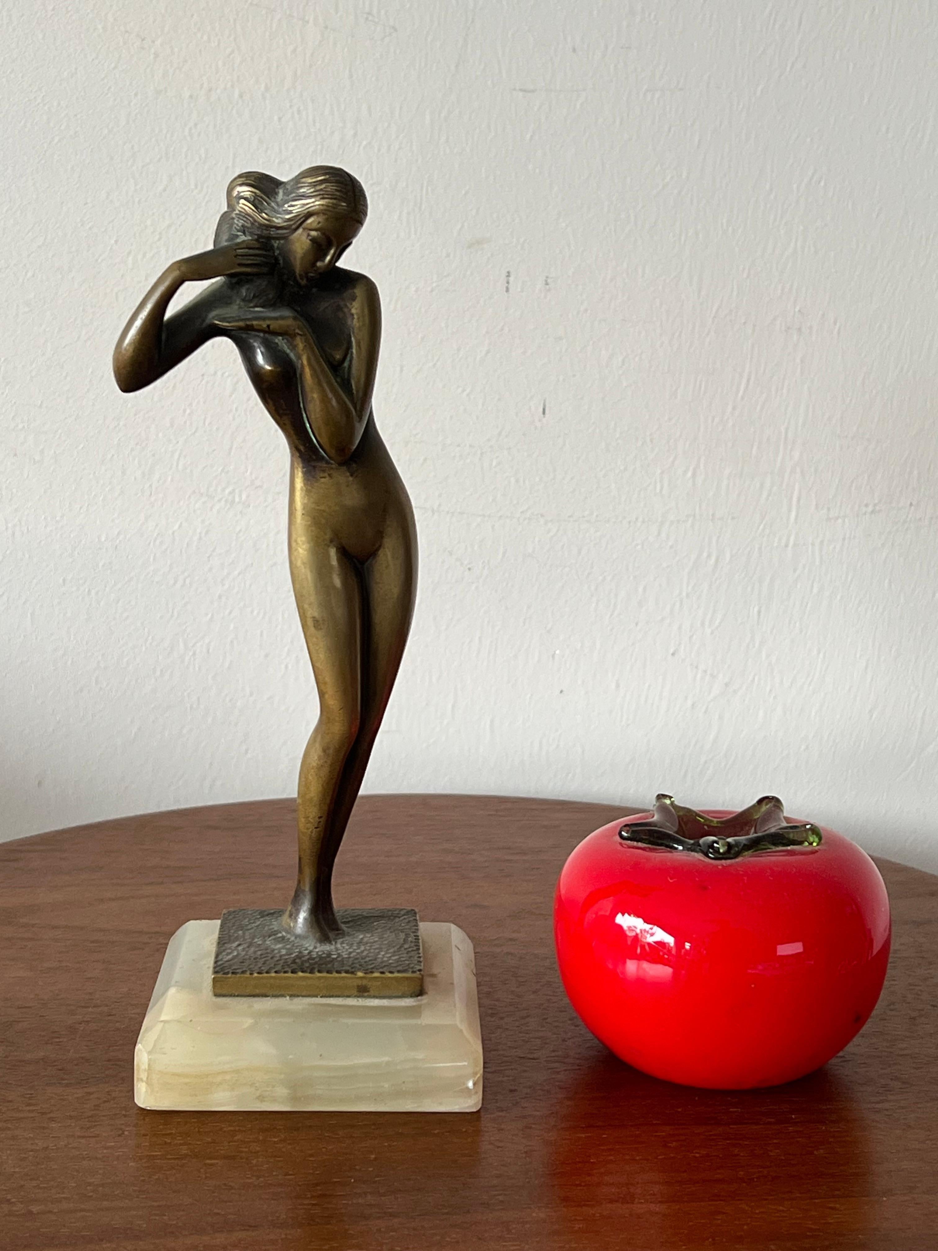 A lovely bronze nude statue. Nicely done with rich patina, on alabaster base.