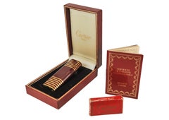 An Elegant Cartier Gold Plated Striped Burgundy Lacquer Finish Art Deco Design
