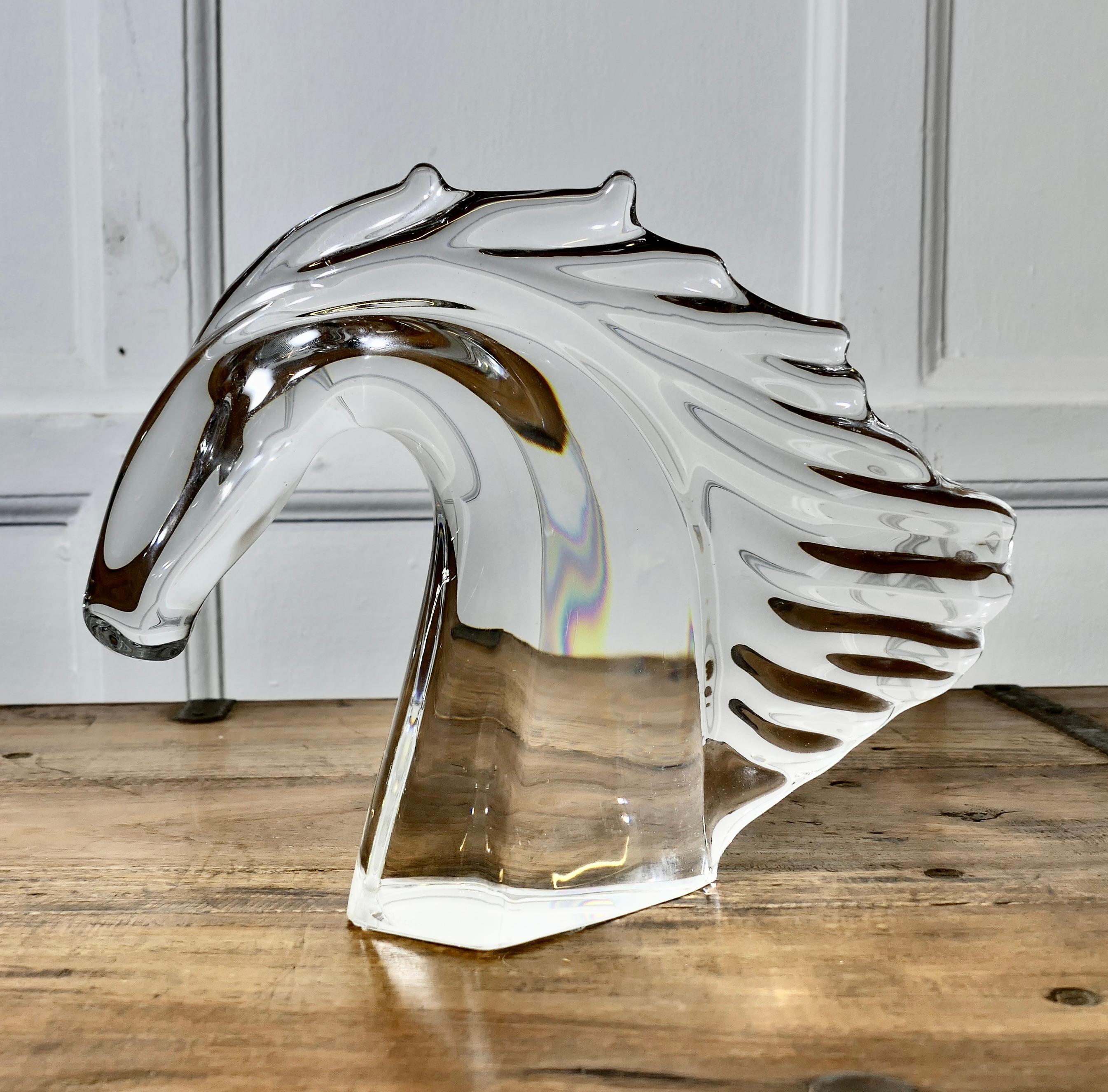 An Elegant Crystal Head of a Horse Signed by Daum of Nancy France

A wonderful piece in excellent condition with a very minor chip underneath, the Horse head is signed at the bottom Daum
Daum is famous for mostly Art Nouveau glass much of which has