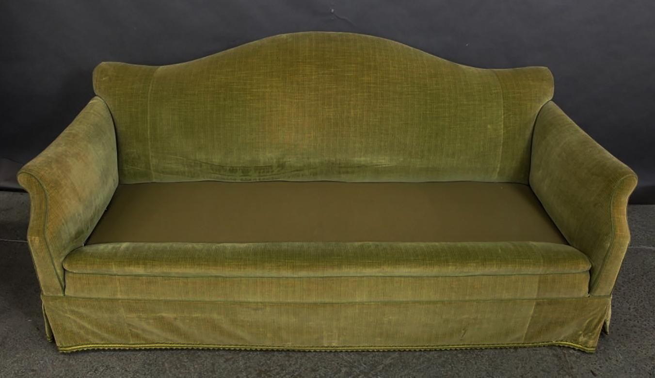Classic, elegant tight-back, single loose seat cushion, skirted English Camelback Sofa. The delicate curved arms and back wing detail complement the overall design. While the frame and construction are sound it is shown in it's original velvet, and