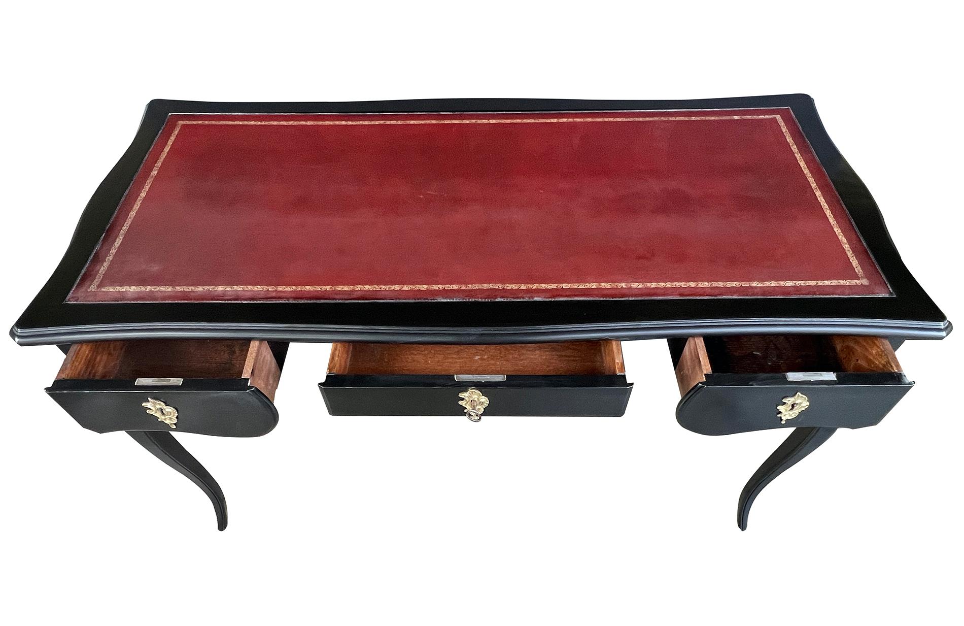 Rococo Revival An Elegant French Louis XV Style Ebonized 3-Drawer Writing Desk with Leather Top For Sale