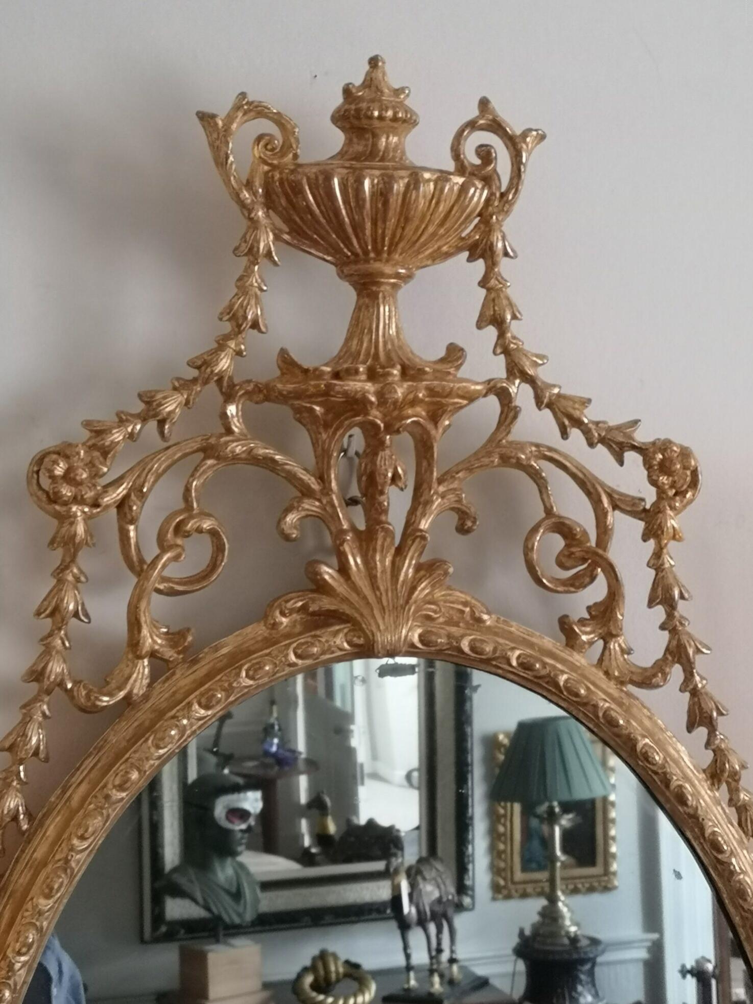 An elegant George III giltwood and carton-pierre oval pier glass In Excellent Condition For Sale In Reepham, GB