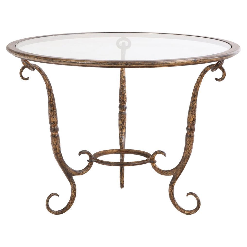 Elegante mesa de hierro dorado y tapa de cristal, posiblemente de Giovanni Banci, c. 1970. en venta