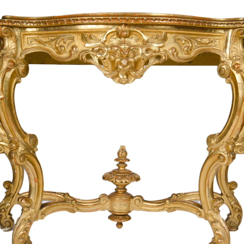 An elegant Italian carved giltwood marble top console table circa 1880. Gilt details including curvaceous cabriole legs.