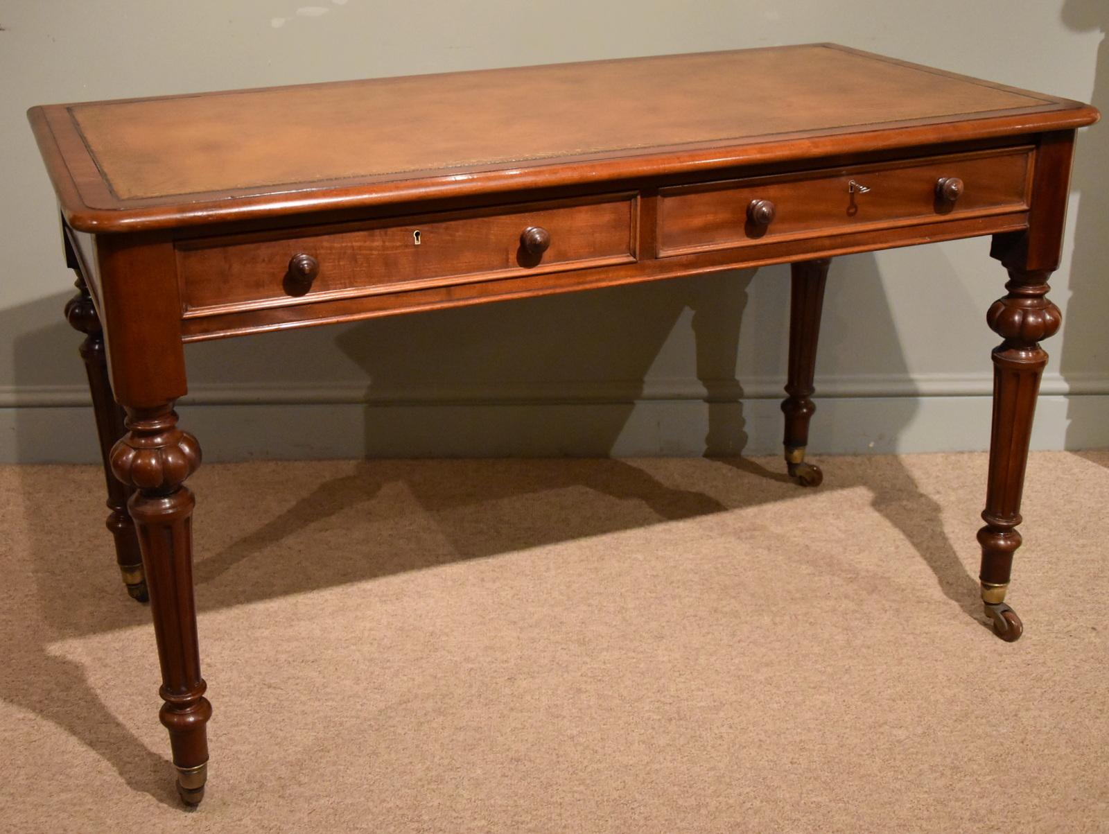 An elegant late William IV mahogany leather topped writing table

Dimensions:
Height 28.5