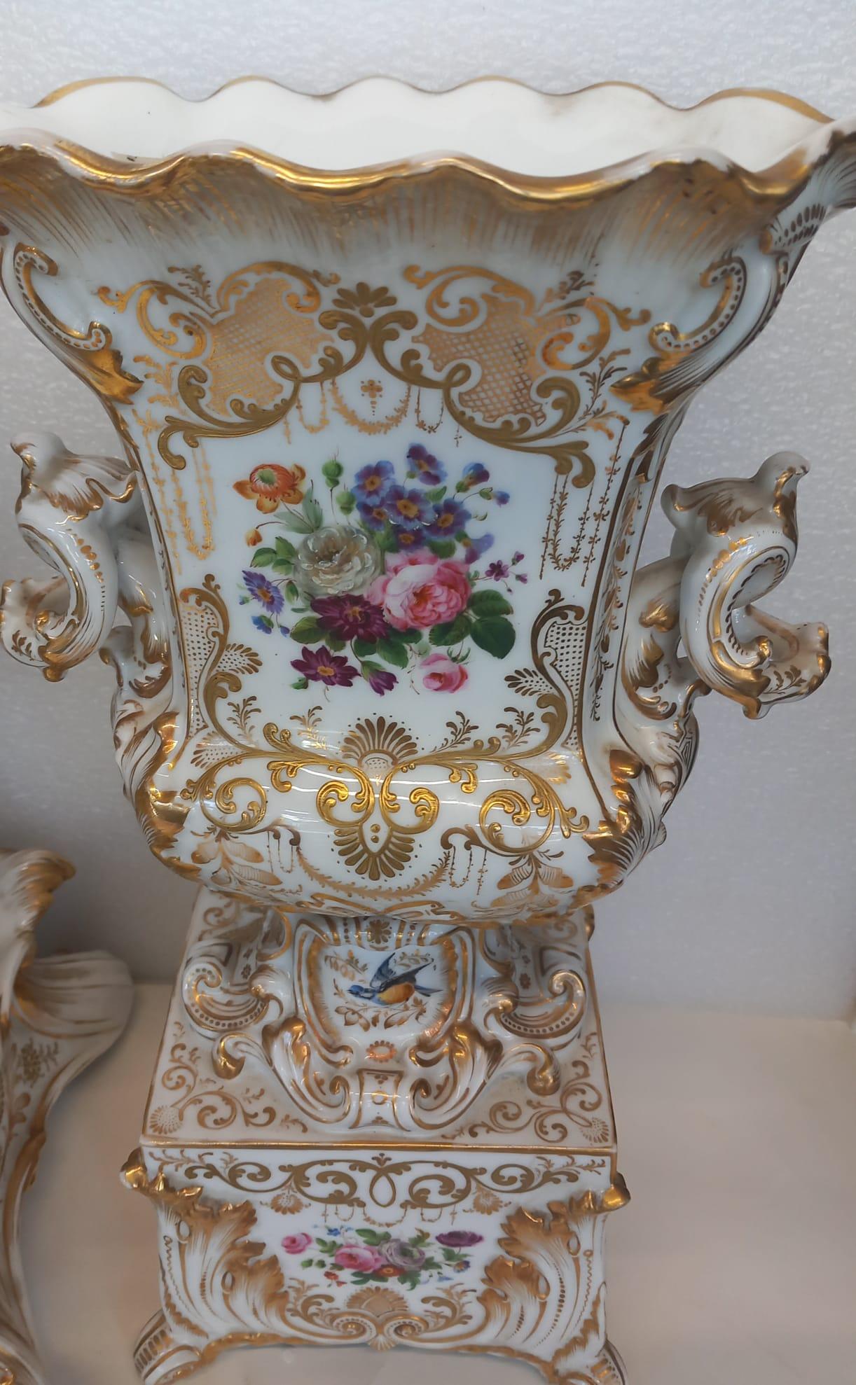 Porcelain An elegant mantle piece clock with vases made in Paris circa 1860 For Sale