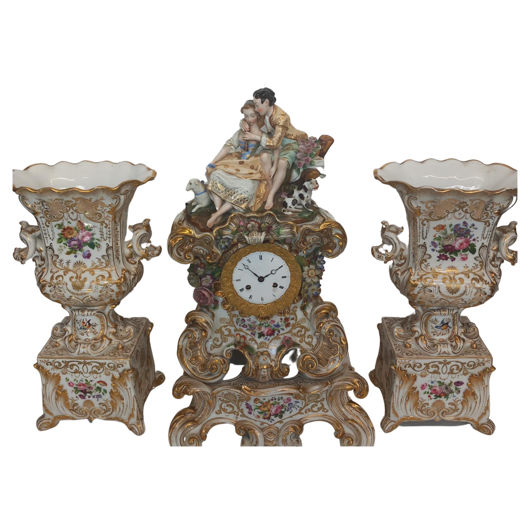 An elegant mantle piece clock with vases made in Paris circa 1860 For Sale