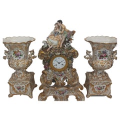 An elegant mantle piece clock with vases made in Paris circa 1860