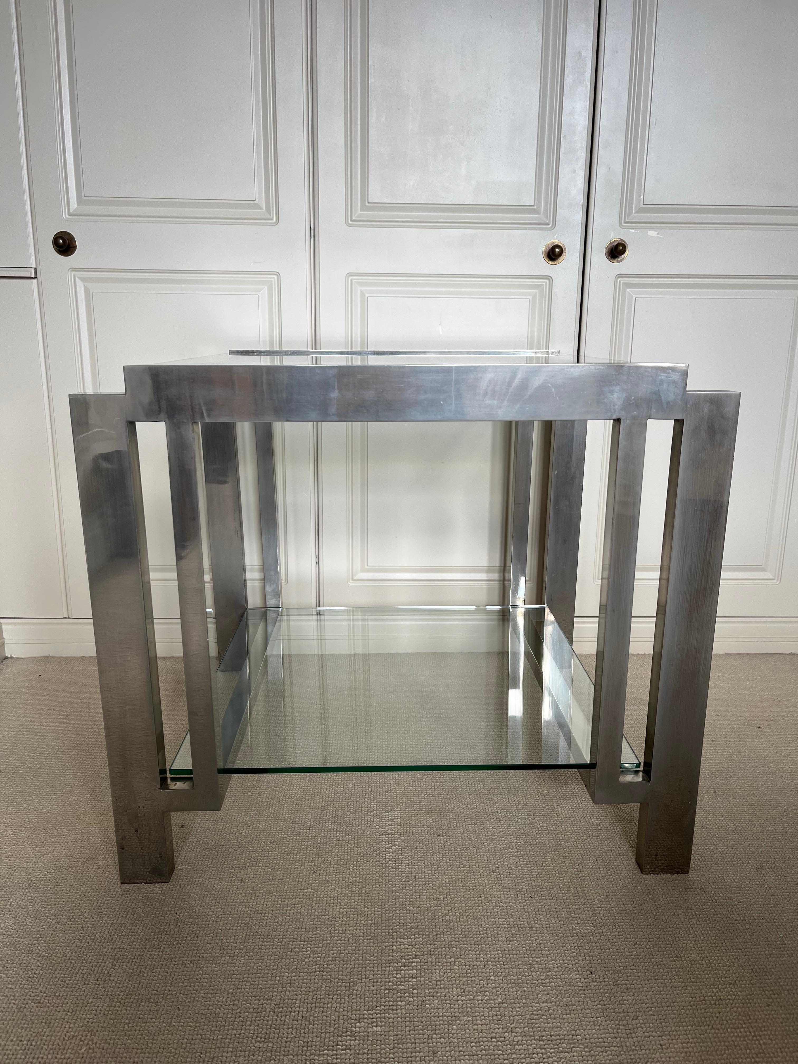 A very elegant two tier nickel on brass side table with glass shelves. (replaced glass).