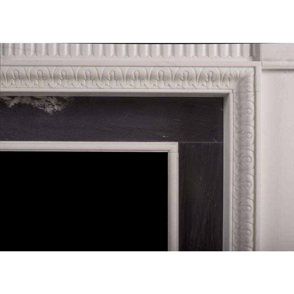 English An elegant neoclassical style limestone fireplace, reflecting the designs of the For Sale