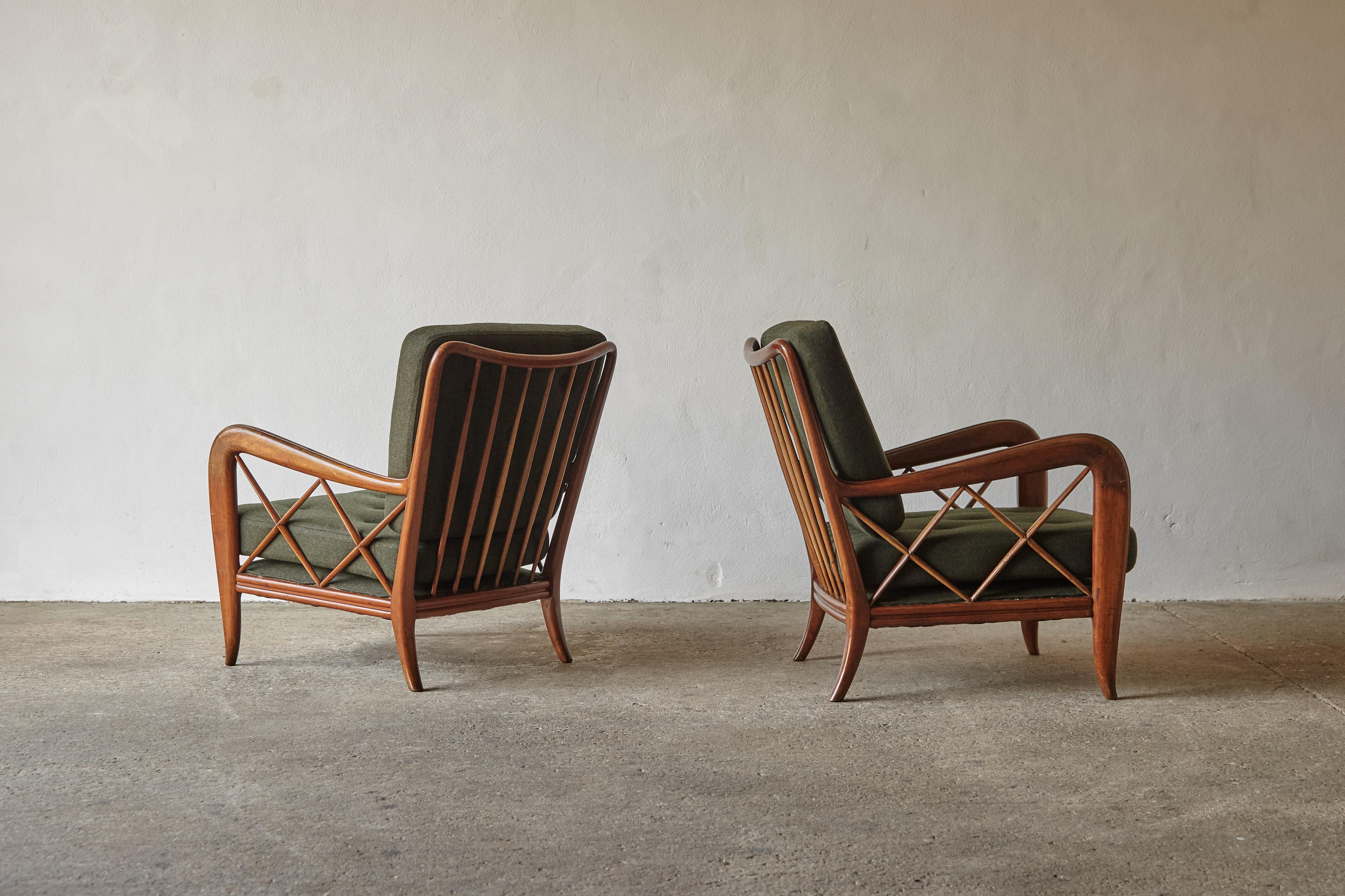 A beautiful pair of Paolo Buffa attributed lounge chairs, Italy, 1950s. The wooden frames are in original condition with signs of age - small dents, marks, a few small repairs. The seat and cushions are newly upholstered in a premium green wool