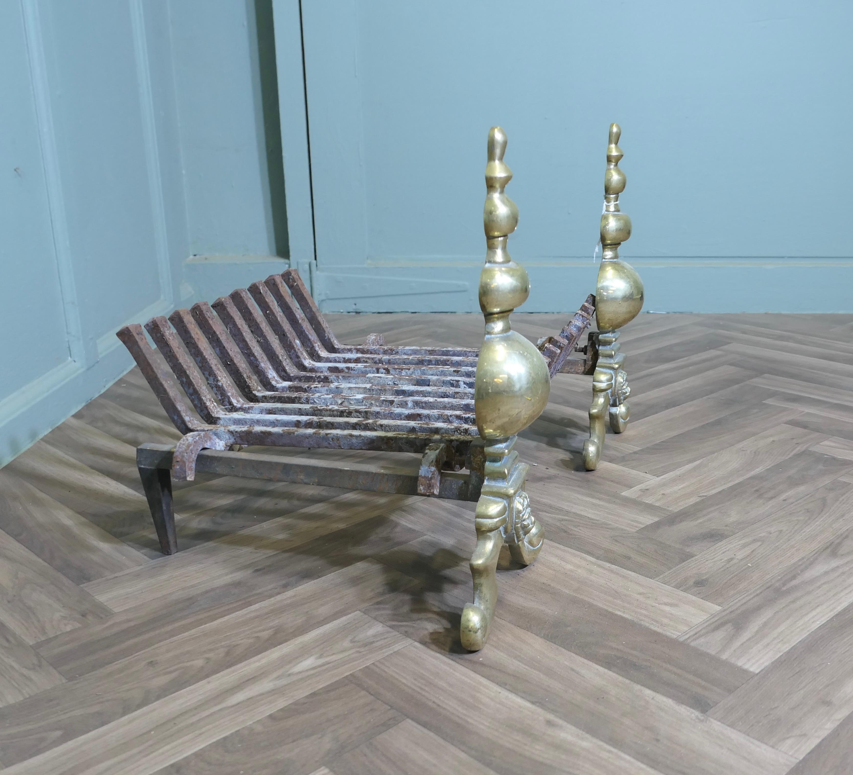 An Elegant Pair of Brass Andirons Complete with Grate For Sale 1