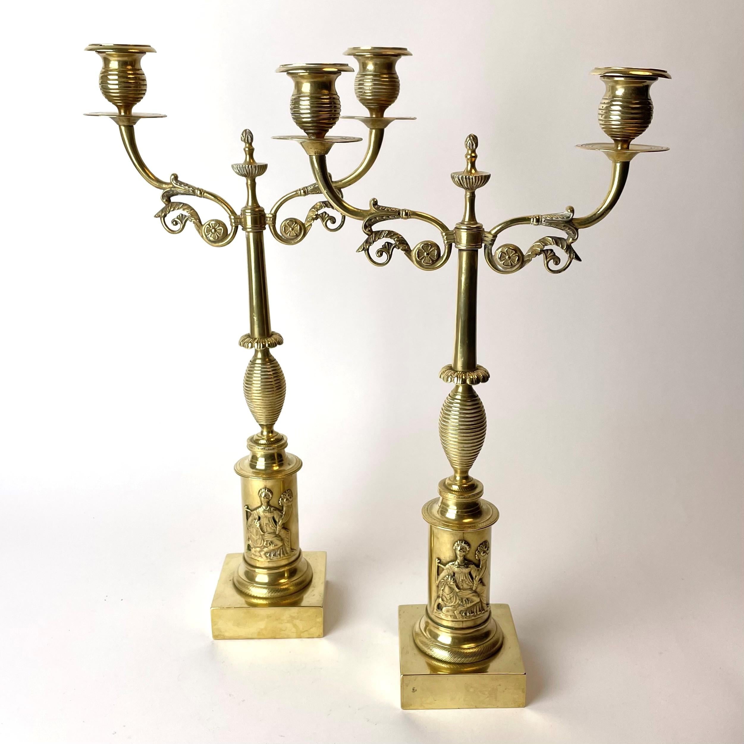 An elegant pair of Candelabras in brass from the 1820s. Swedish Empire (Karl Johan), with a simple and tasteful design.

Wear consistent with age and use.