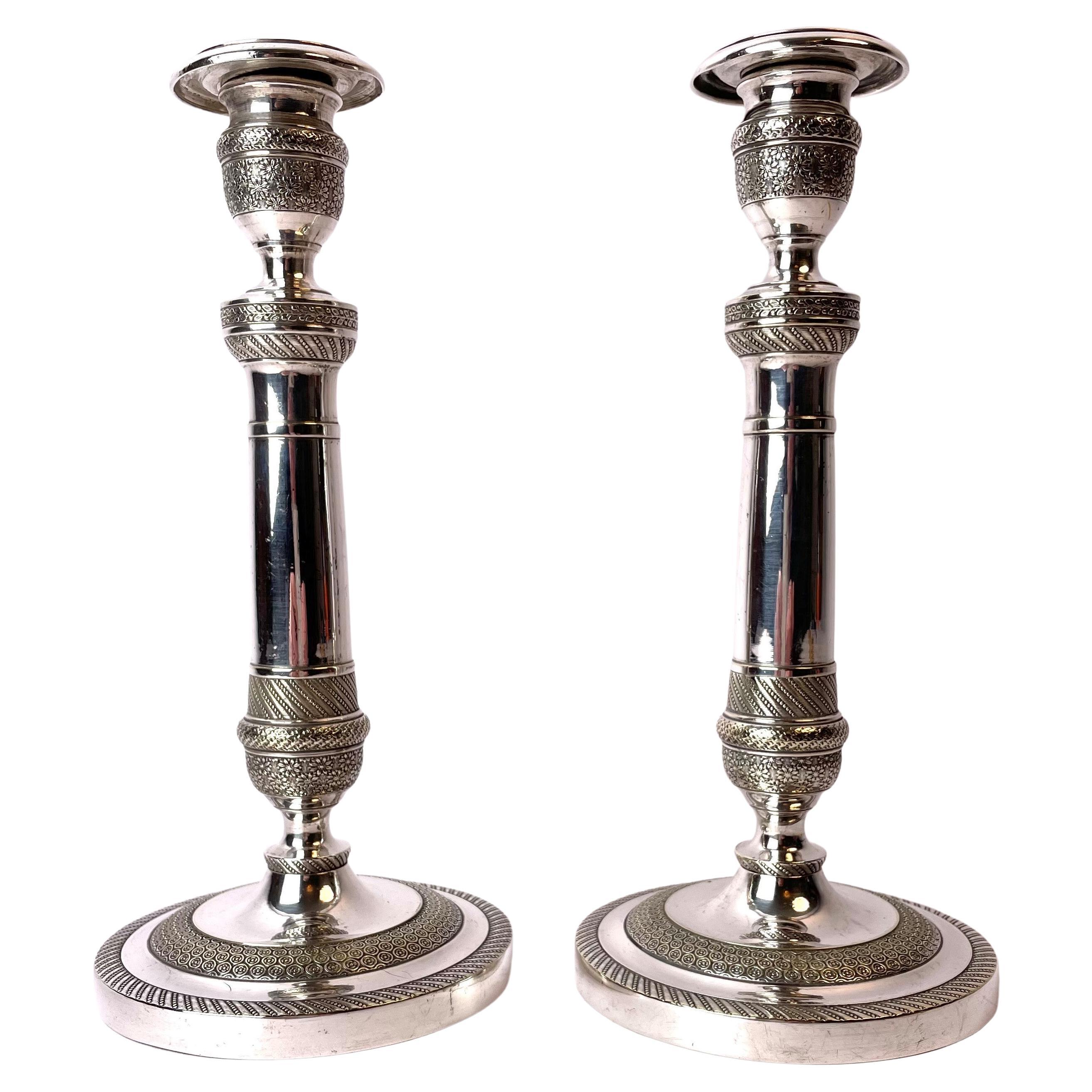 An Elegant pair of empire candlesticks in Argent haché