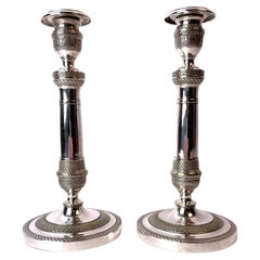 An Elegant pair of empire candlesticks in Argent haché