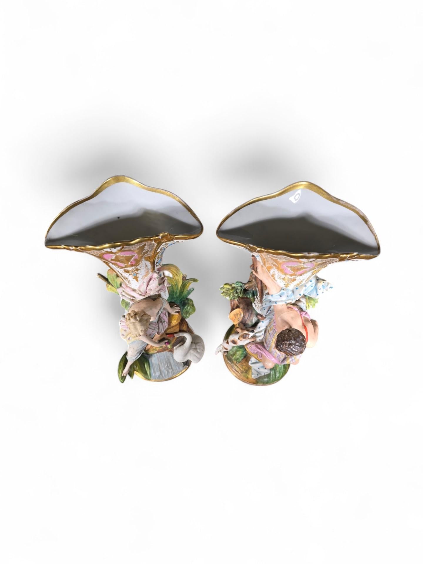 An elegant pair of French porcelain vases, circa 1860, finely decorated with two detailed figures. These vases exhibit excellent craftsmanship and remain in good condition, with normal signs of wear consistent with their age.

Dimensions: 35 x 20 x