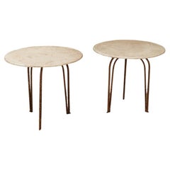 an elegant pair of marbletopped iron art deco tables 