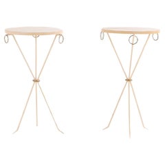 An elegant pair of painted iron drinks tables in the manner of Jean-Michel Frank