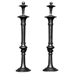 Elegant Pair of Turned Polished Cast Iron Andirons