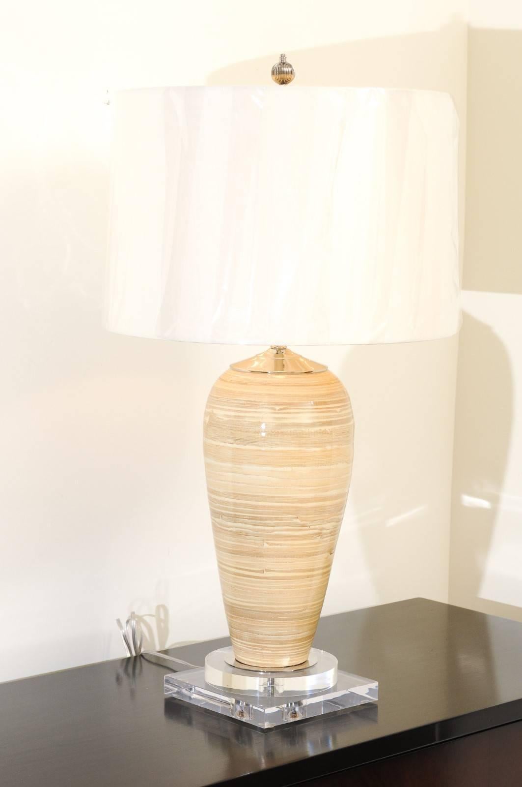 These magnificent lamps are shipped as photographed and described in the narrative. They are custom built using materials of the highest quality and are shipped complete with the new shades, harps and finials shown in the photos.

An exquisite pair
