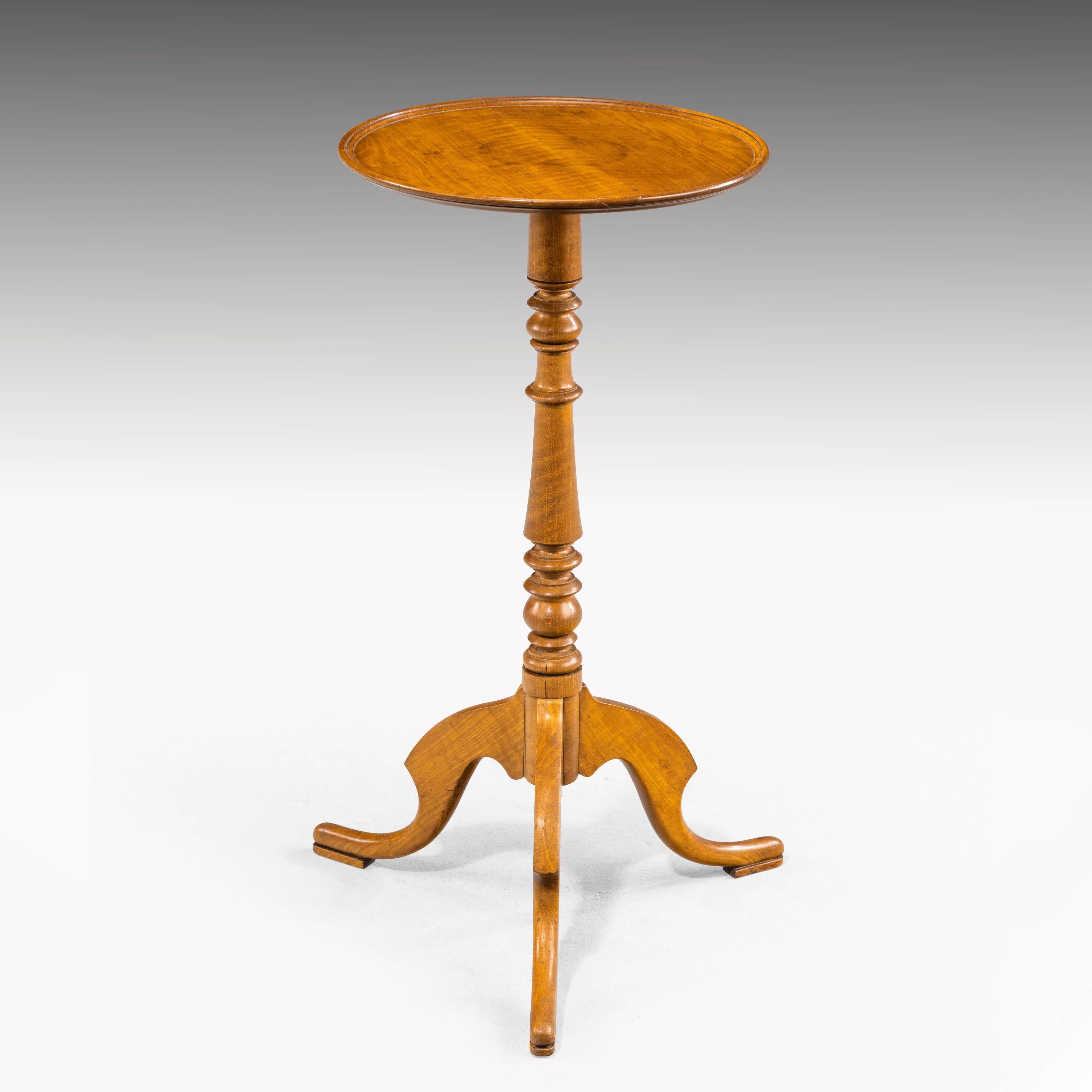 An elegant Regency period satinwood occasional wine table. On a finely turned central support. The top finished with very well figured timbers.
            