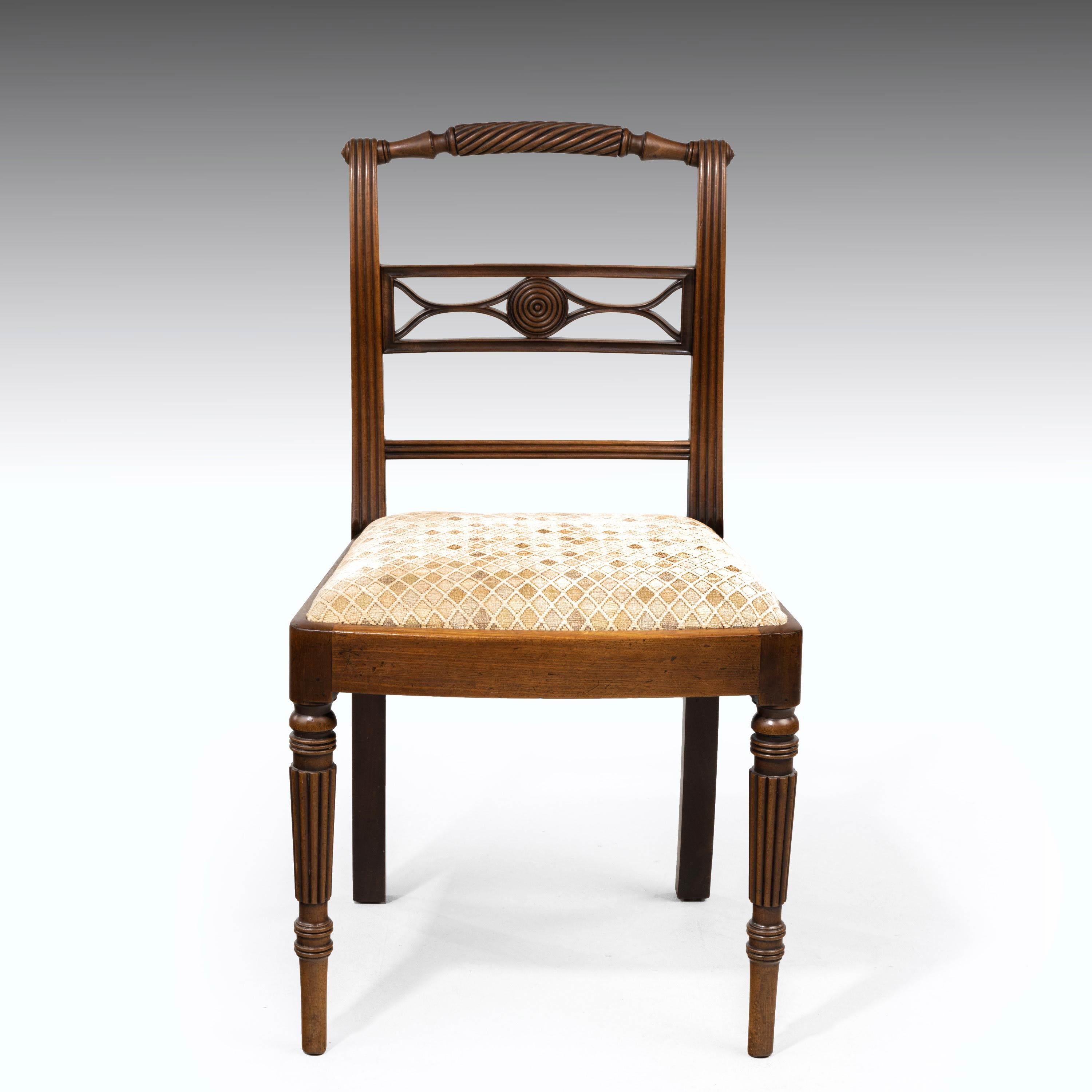 An elegant set of four Whitehaven Regency period single chairs. With finely carved details including a raised rope twist section to the top. Reeding all the way down the uprights. Bow seats and finely chamfered supports. In excellent overall