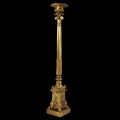 An elegant single gilt bronze torchère