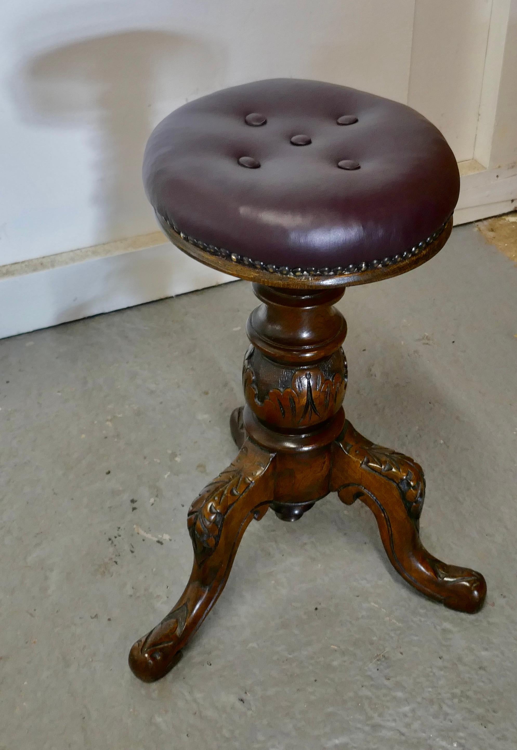 An Elegant Victorian Walnut and Leather Stool 

This is a very attractive and good quality piece, the stool stands on a heavy carved baluster column with 3 feet, the top is button upholstered in burgundy leather
The stool is in very good