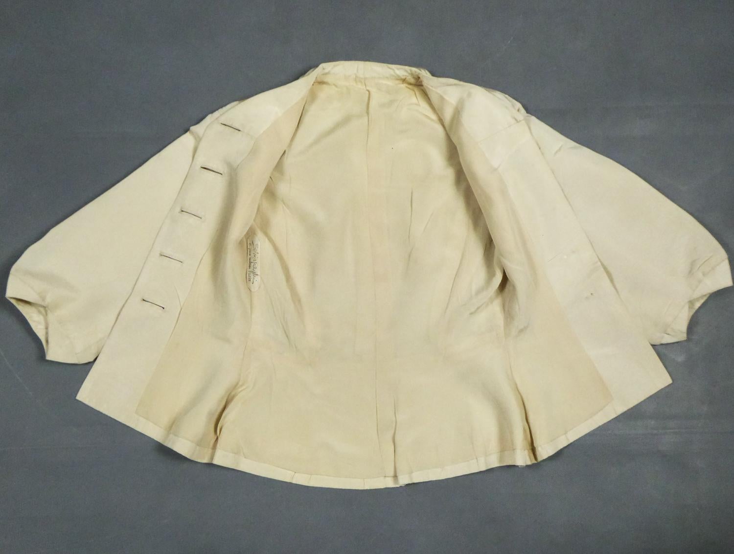 An Elsa Schiaparelli Bar Jacket in Cream Silk Numbered 89254 Circa 1947-1950 8