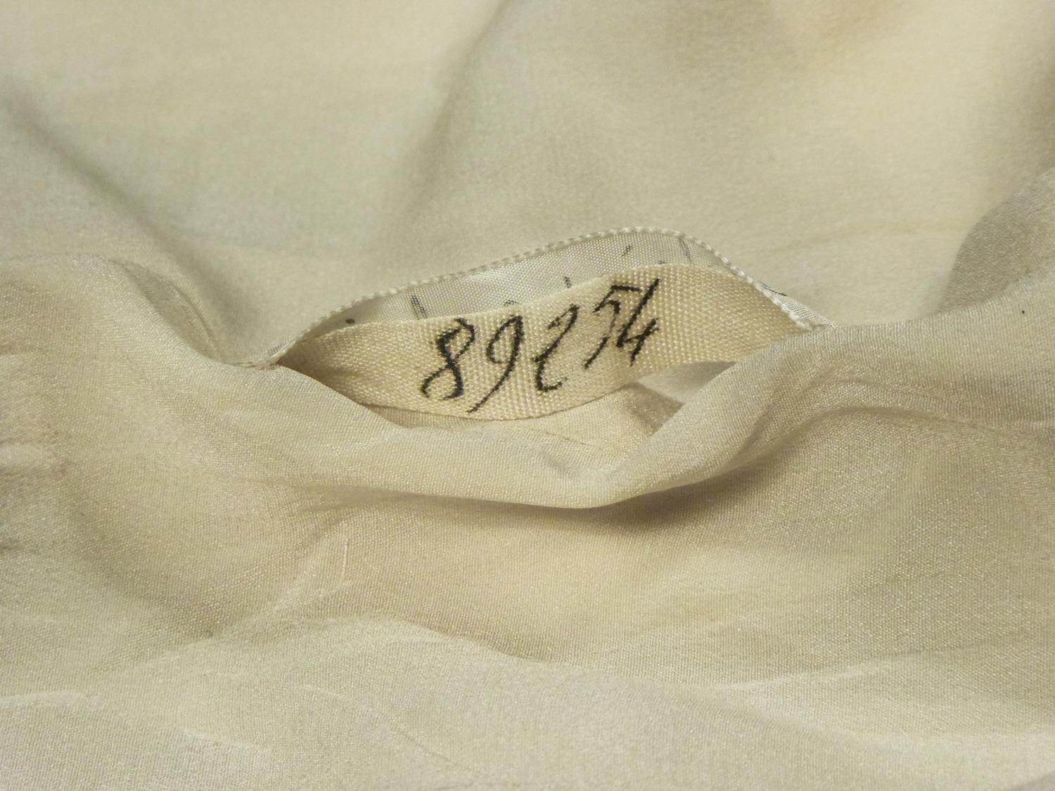 An Elsa Schiaparelli Bar Jacket in Cream Silk Numbered 89254 Circa 1947-1950 10
