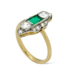 An Edwardian emerald and diamond ring