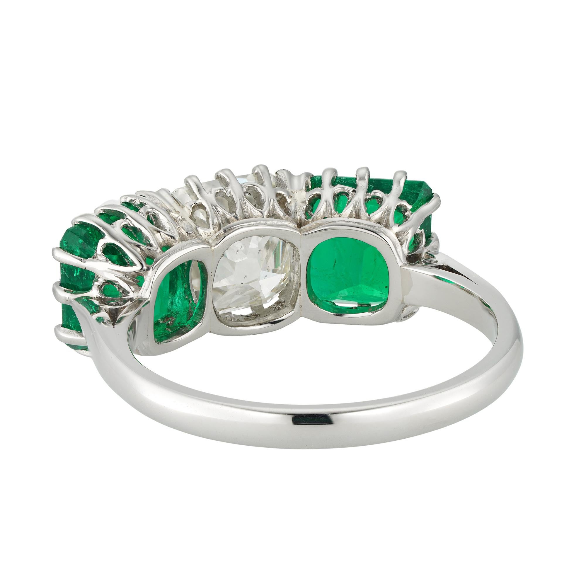 Modern An emerald and diamond three stone ring For Sale