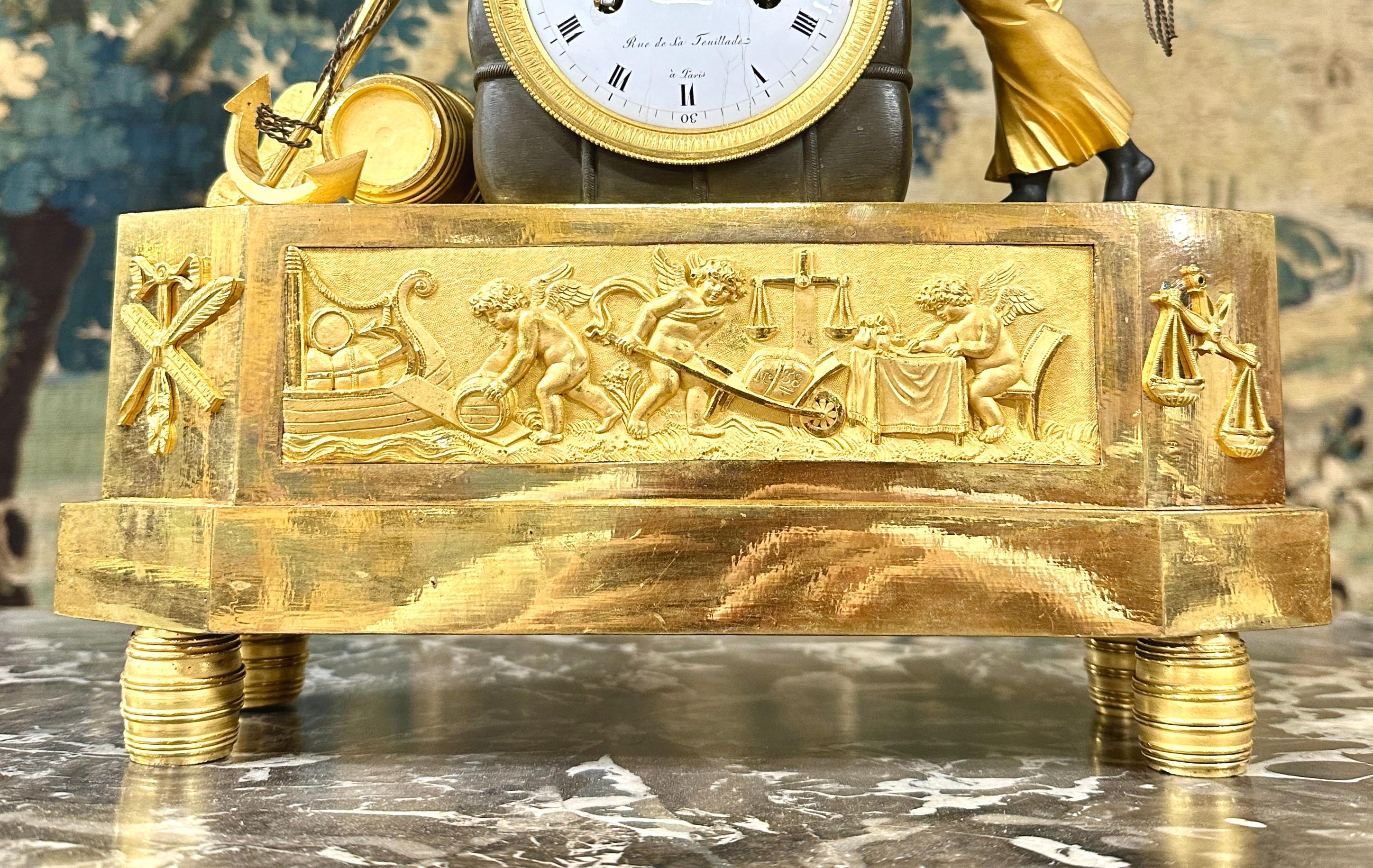 Gilt an Empire ormolu and patinated bronze mangel clock after a drawing by DeVerberie For Sale