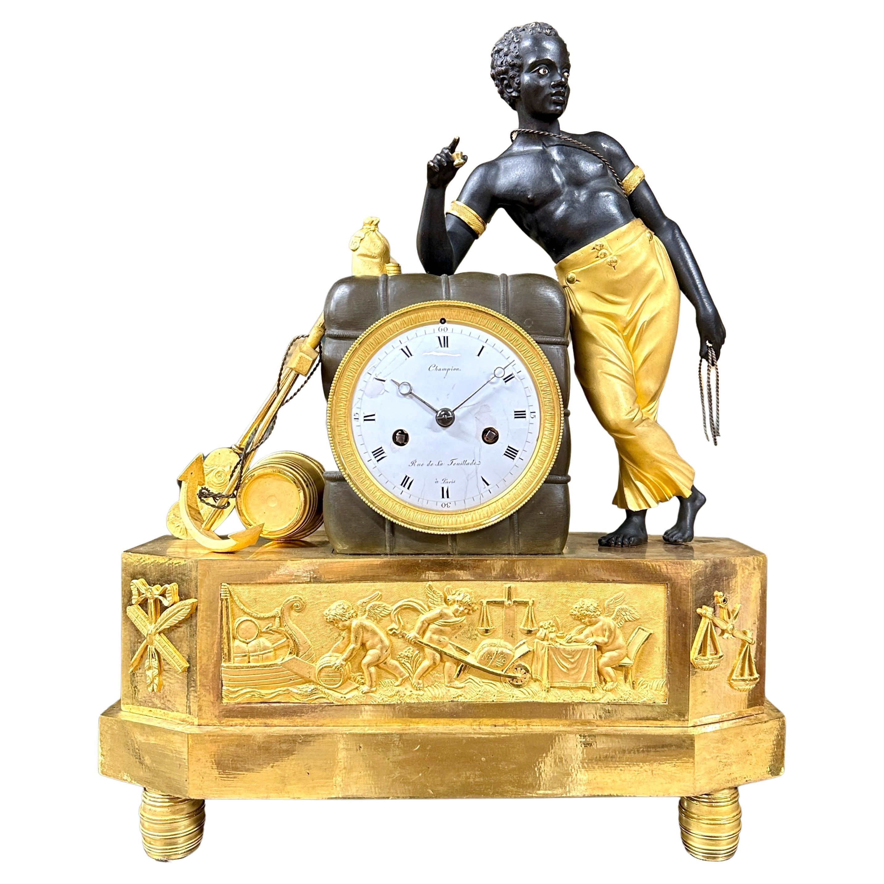 Horloge Empire en bronze doré et patiné d'après un dessin de DeVerberie en vente