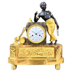 Antique an Empire ormolu and patinated bronze mangel clock after a drawing by DeVerberie