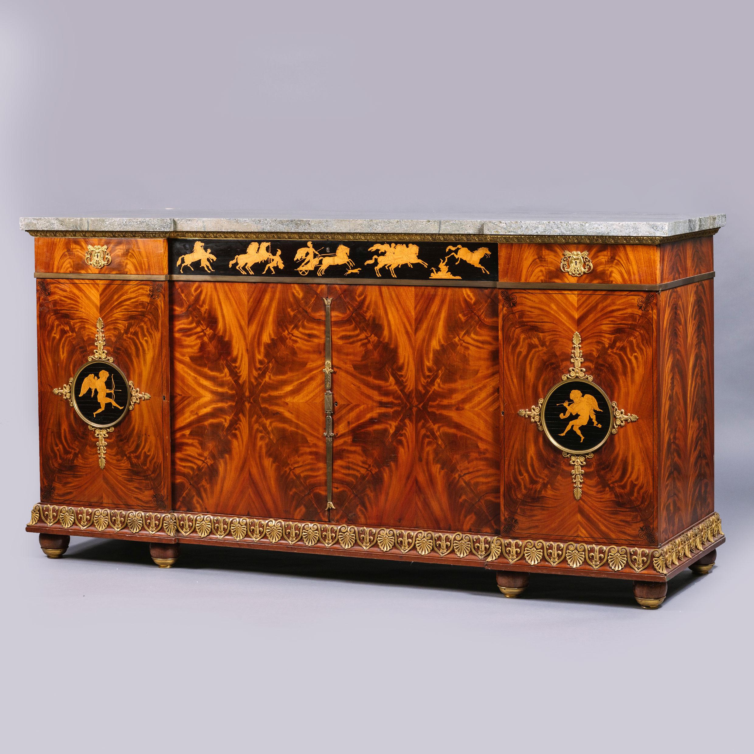 An Empire style gilt-bronze mounted marquetry buffet cabinet, by François Linke, Paris.

This handsome buffet or side cabinet has its original Swedish green marble top. The veneers are of the finest figured acajou flammé. The frieze is fitted with