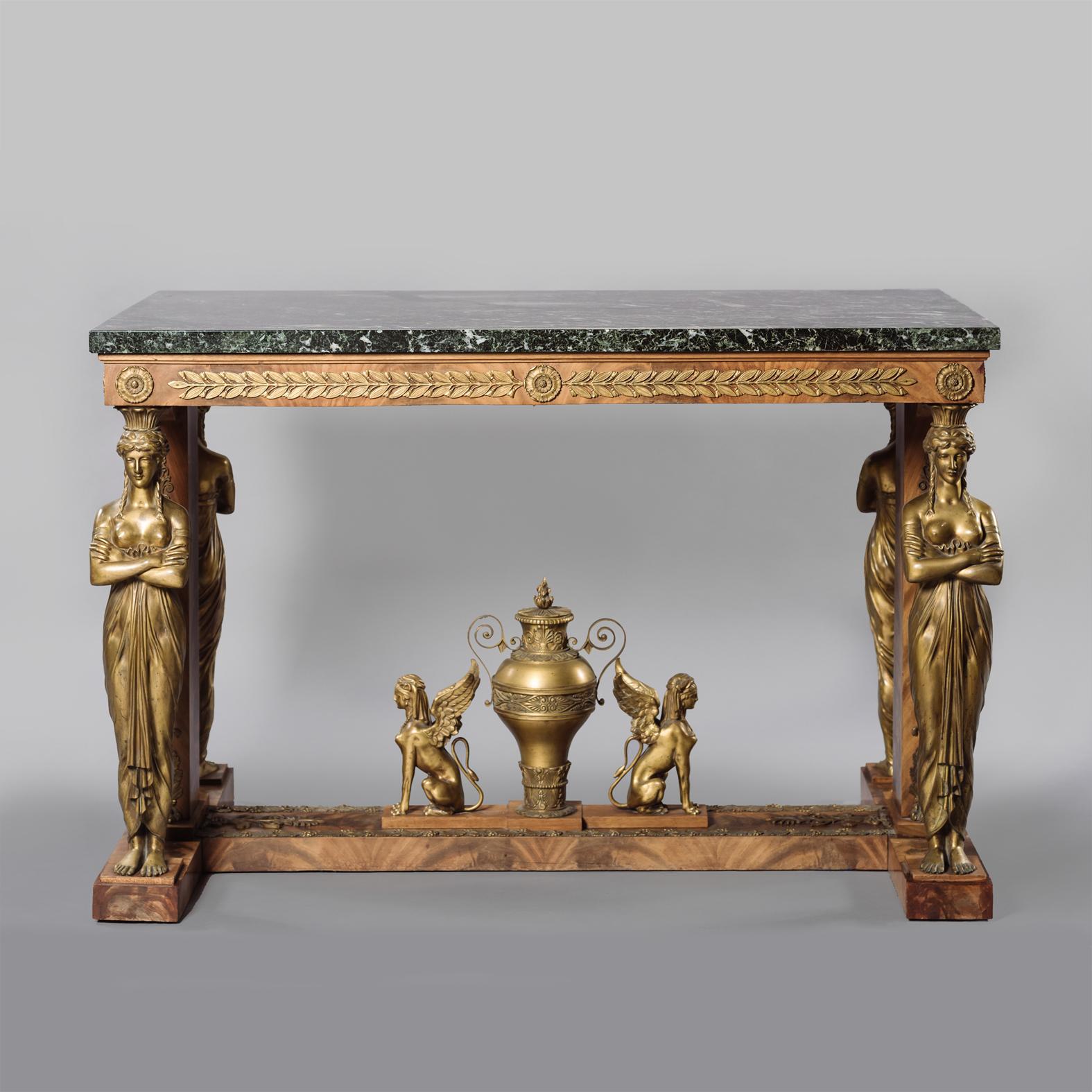 A very fine Empire style gilt-bronze mounted mahogany table de Milieu, with a Verde Antico Marble Top, in the Manner of Jacob Desmalter. 

The rectangular marble top above a frieze applied with laurel leaves on gilt-bronze female caryatid supports