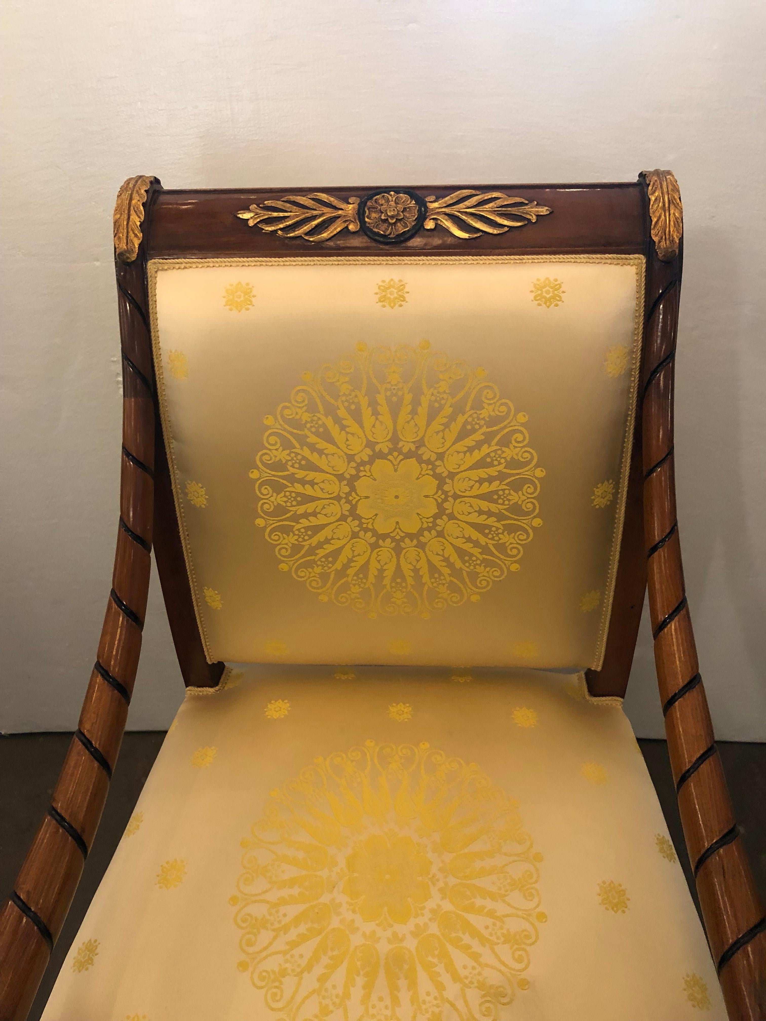 Unique piece Empire style parcel gilt and Ebonized armchair.

