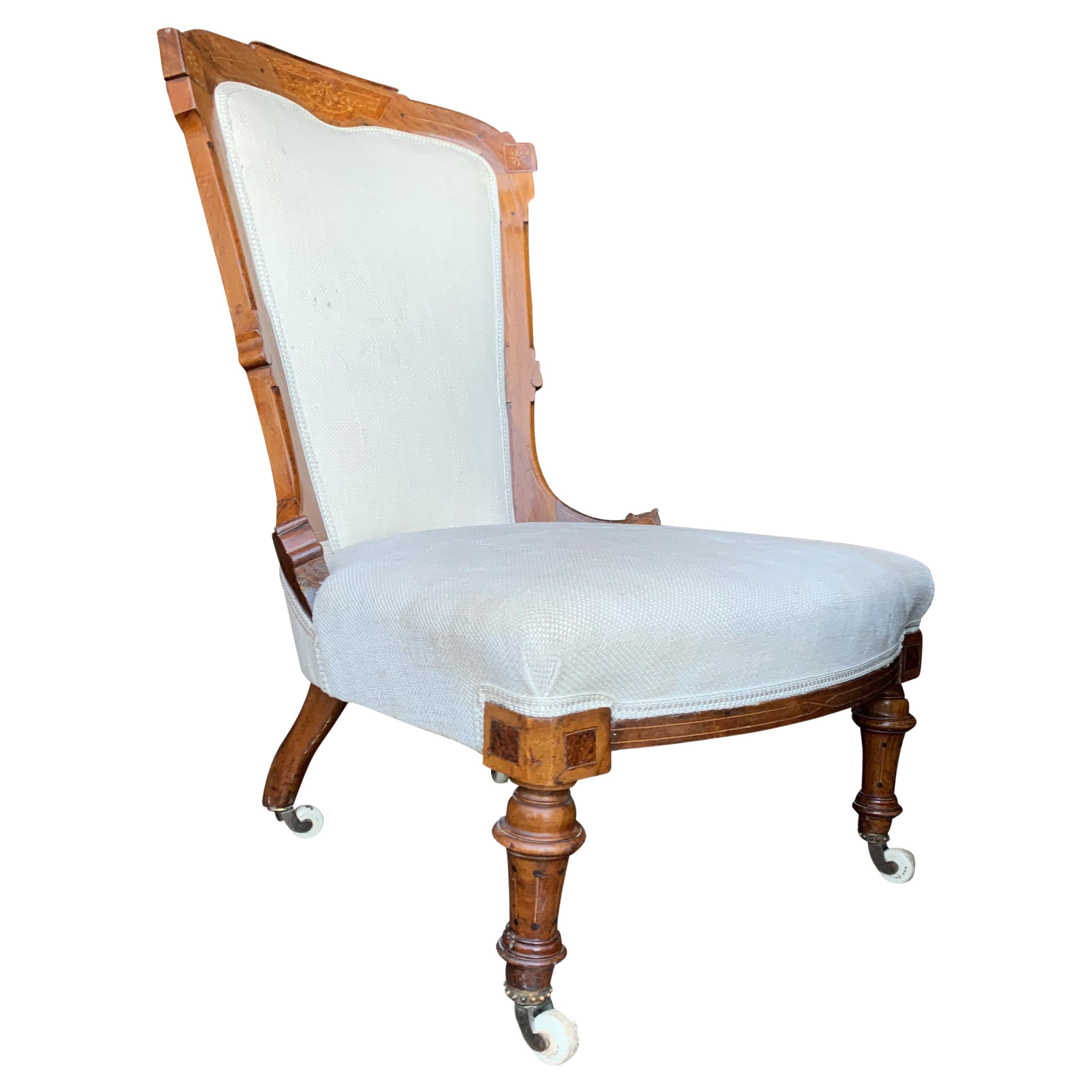An Empire Walnut Upholstered Salon Chair With Decorative Inlay & Ceramic Castors For Sale