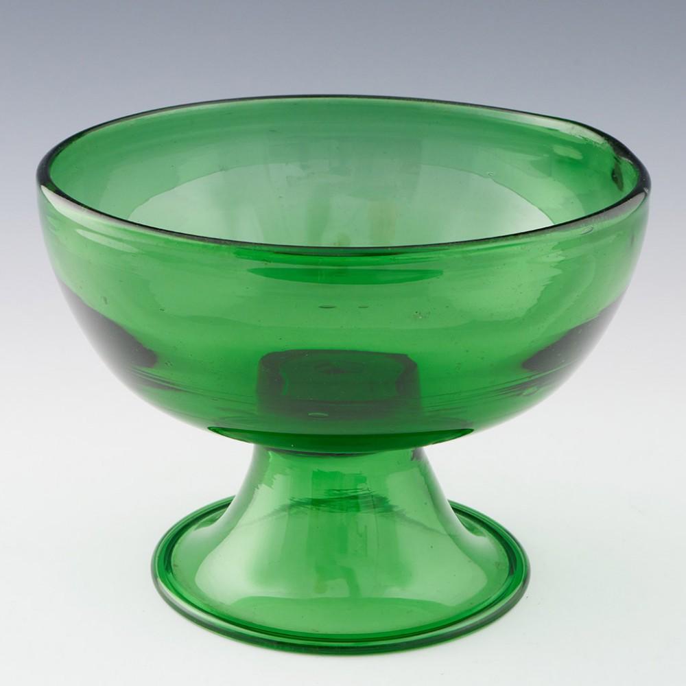 Heading : An Empoli glass vase
Date : 1970s
Origin : Empoli, Tuscany
Bowl Features : Conical foot and folded rim
Marks : None
Type : Lead glass
Size : Height 16cms, diameter 21cms
Condition : Good. Some inclusions and typical bubbled within the