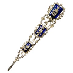 Used An enamelled glass, clear paste and silver large chatelaine clip, France, 1800s.