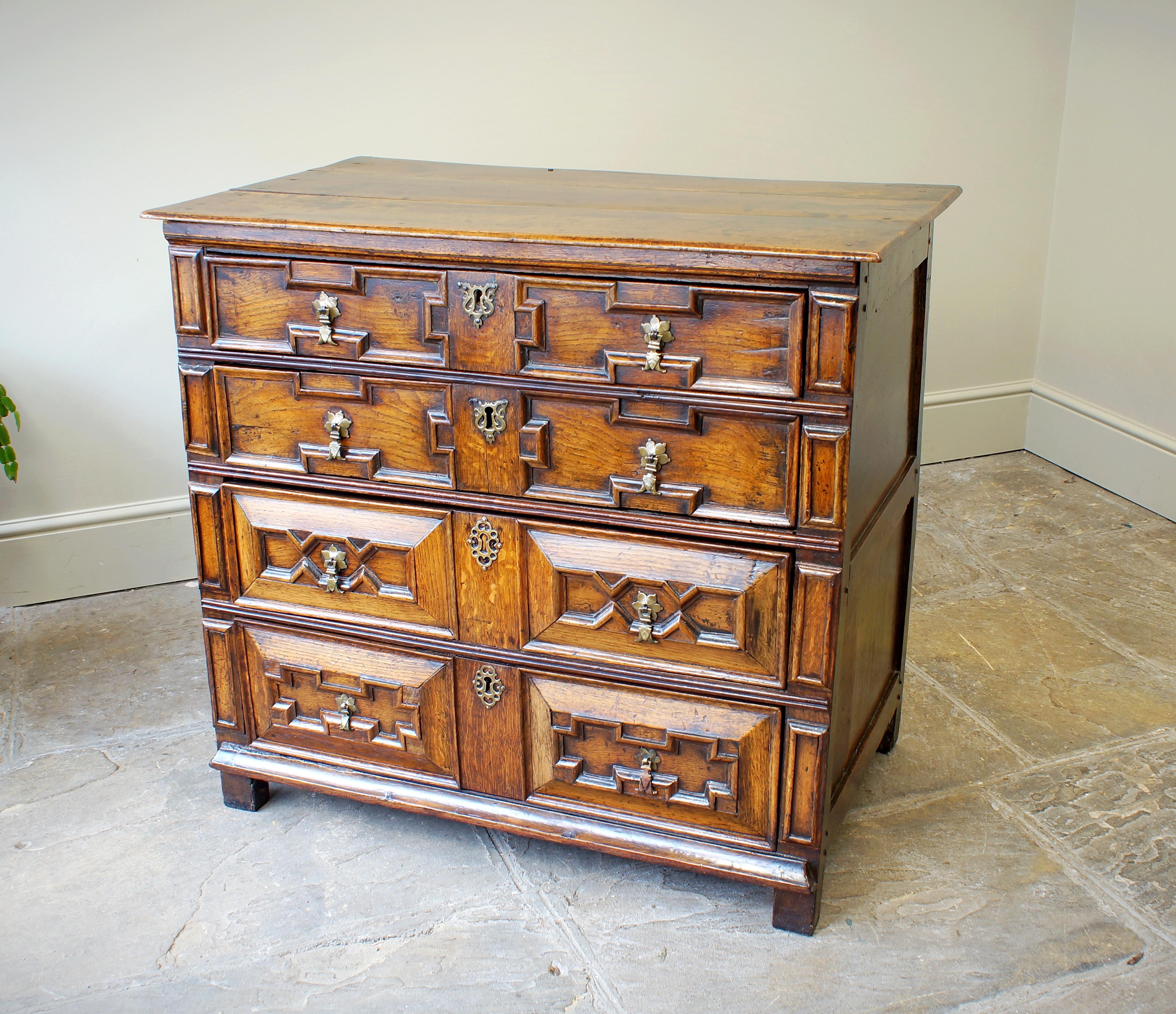 A very good 17th Century Cushion Moulded Chest Of Drawers, of small proportions and in excellent original condition. The drawer linings are constructed of elm and are hung on side runners. The chest retains most of its original brassware and has a