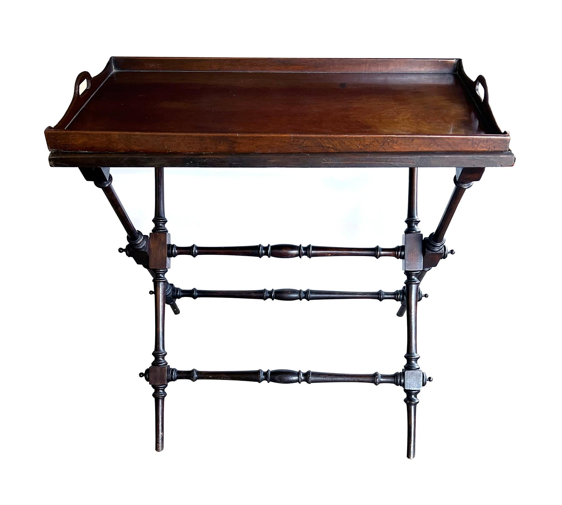 perfect for a bar/drinks table, the large rectangular tray with raised gallery and pierced handles raised on a nicely carved folding X-form stand with block and baluster stretchers