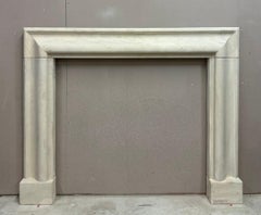 An English Antique Ancaster Stone Bolection Fireplace Mantel