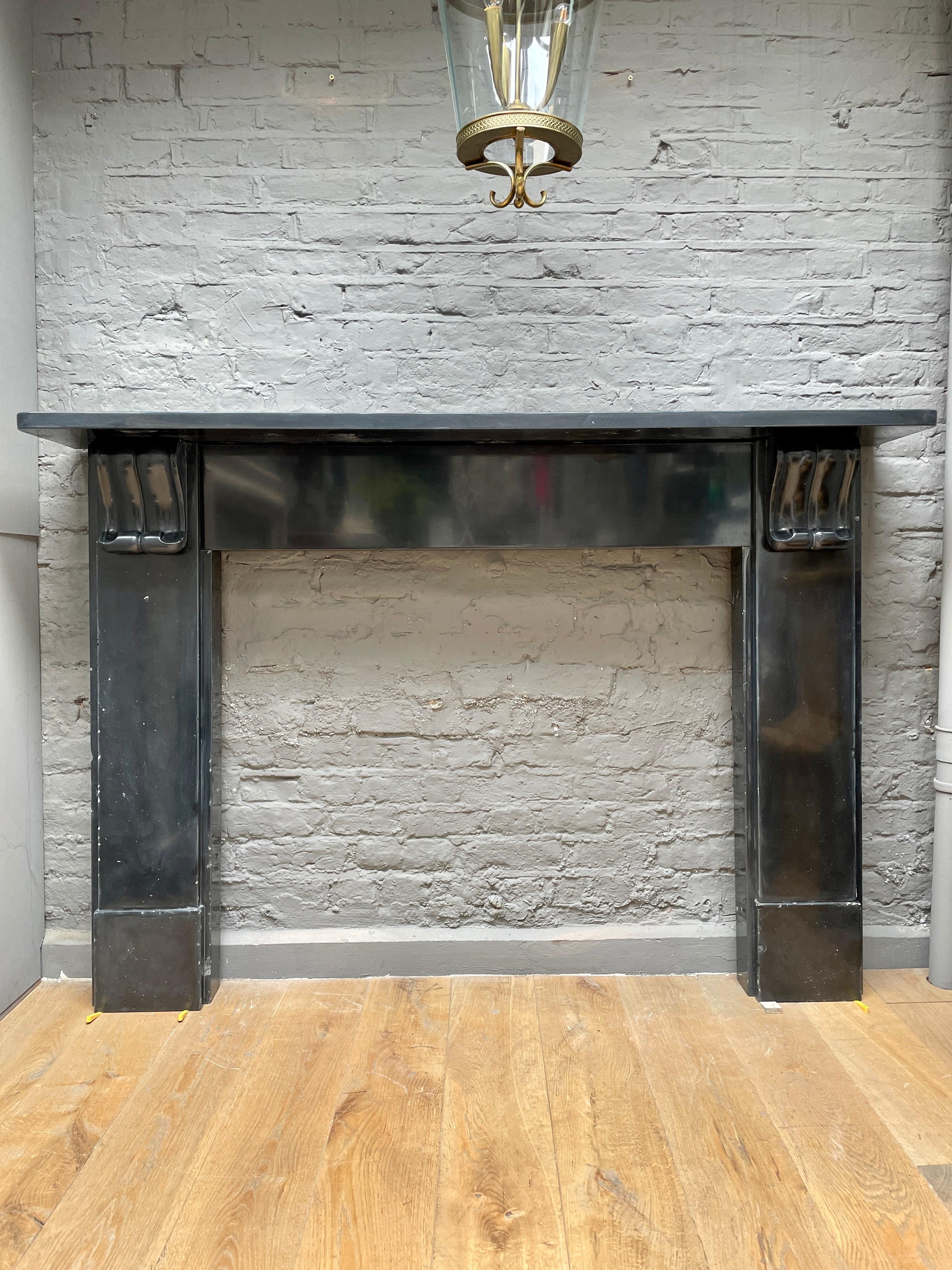 Carved English Antique Fireplace Mantel in Belgian Black Marble For Sale
