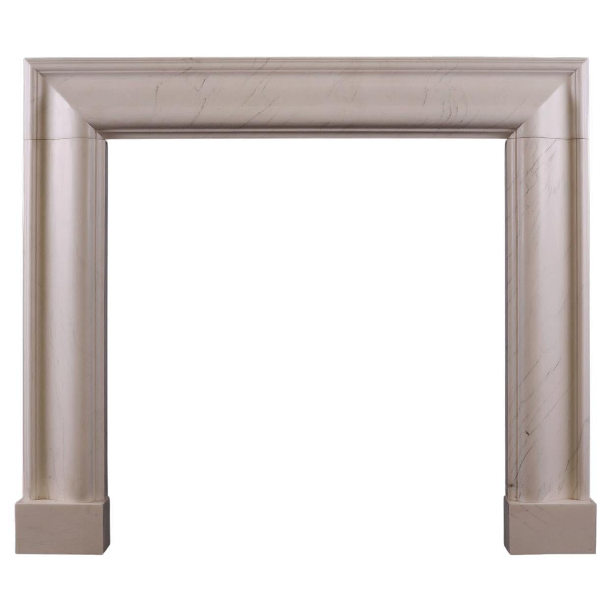 An English Bolection Fireplace in Venato Light Stone For Sale