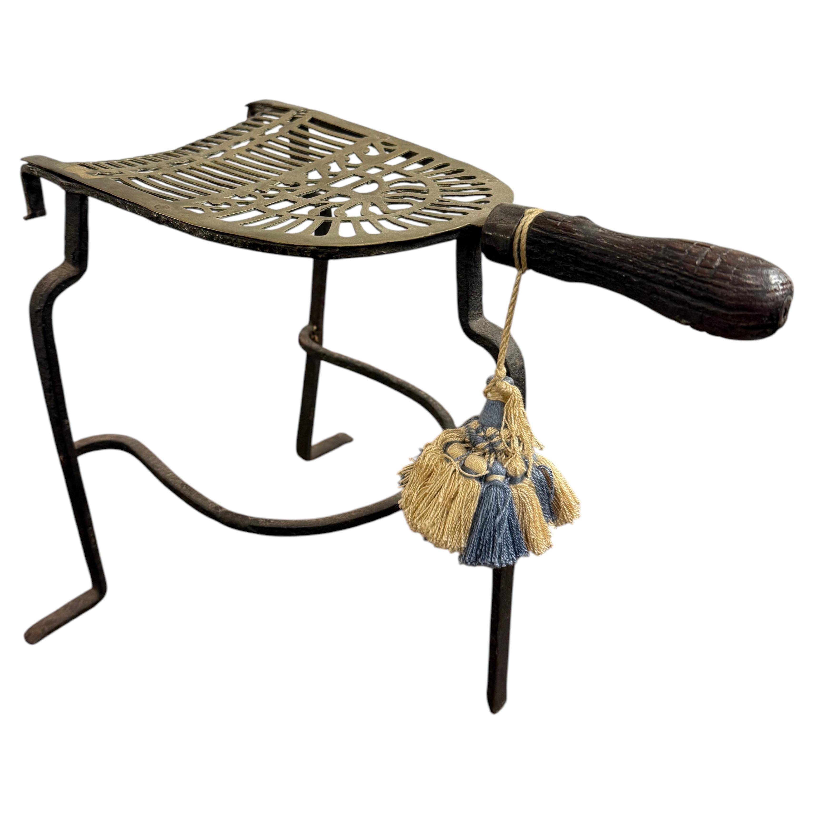 An English Brass and Cast Iron Fireplace Trivet, 18th Century