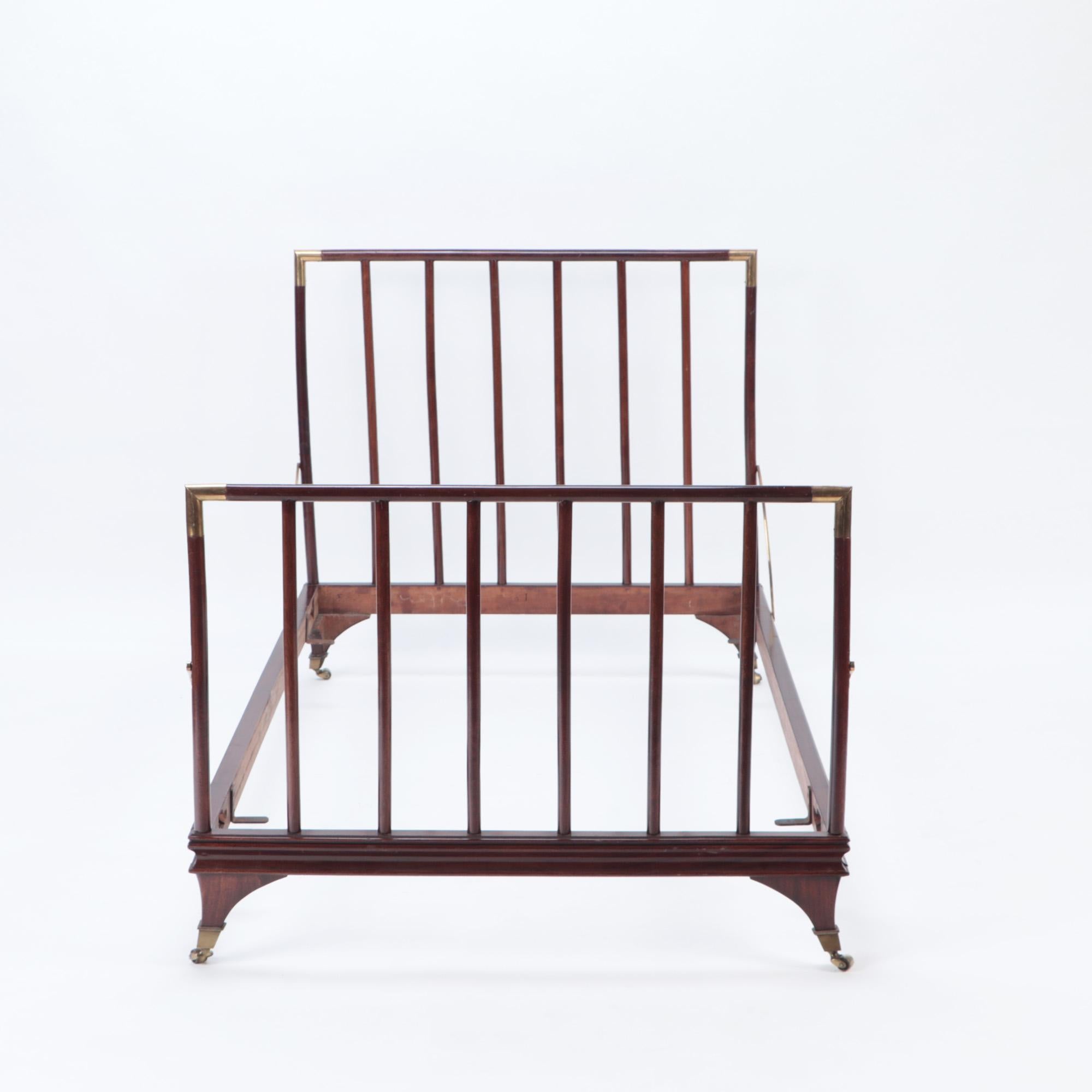 An English brass mounted mahogany campaign bed, circa 1900. One of a pair. Identical bed available as well.
Interior dimensions: 38.75