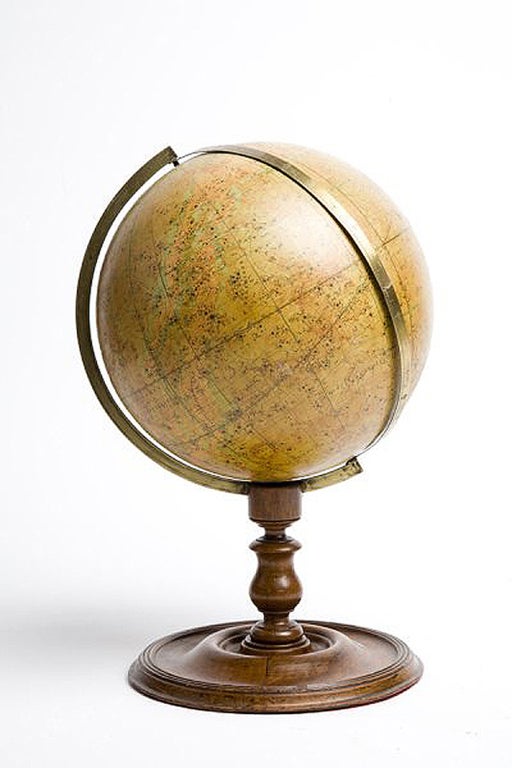 Over a wheel turned wooden base, with round foot, moved profile and tall leg, with a perfect patina, is placed this rare English celestial globe, edited by J. Wyld, Charing Cross East, London. The globe is made out of paper machè finished with